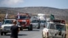 Konvoi truk dari Doctors Without Borders yang membawa perbekalan medis berhenti di pinggir jalan setelah menerima kabar bahwa jalan di depan telah ditutup oleh militer Ethiopia, di wilayah Tigray, Ethiopia utara, 8 Mei 2021.