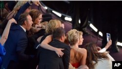 Kevin Spacey, from left, Angelina Jolie, Julia Roberts, Brad Pitt, Jennifer Lawrence, Ellen DeGeneres and Jared Leto join other celebrities for a "selfie" during the Oscars at the Dolby Theatre on March 2, 2014, in Los Angeles.