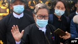 Khin Maung Zaw (C), a lawyer representing detained Myanmar civilian leader Aung San Suu Kyi and ousted president Win Myint, is pictured outside Zabuthiri Township Court in Naypyidaw on February 16, 2021. (Photo by STR / AFP)