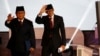 Capres No. 02 Prabowo Subianto (kiri) bersama Cawapres Sandiaga Uno melambai kepada hadirin sebelum acara Debat Capres perdana, Kamis malam (17/1).