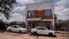 FILE - People walk in front of a hospital in Congo on Nov. 4, 2021. Up to 143 have died from a mysterious, flu-like disease between Nov. 10 and Nov. 25, 2024, in southwestern Congo, local authorities have reported. 