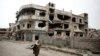 FILE - A devastated part of Homs, Syria.