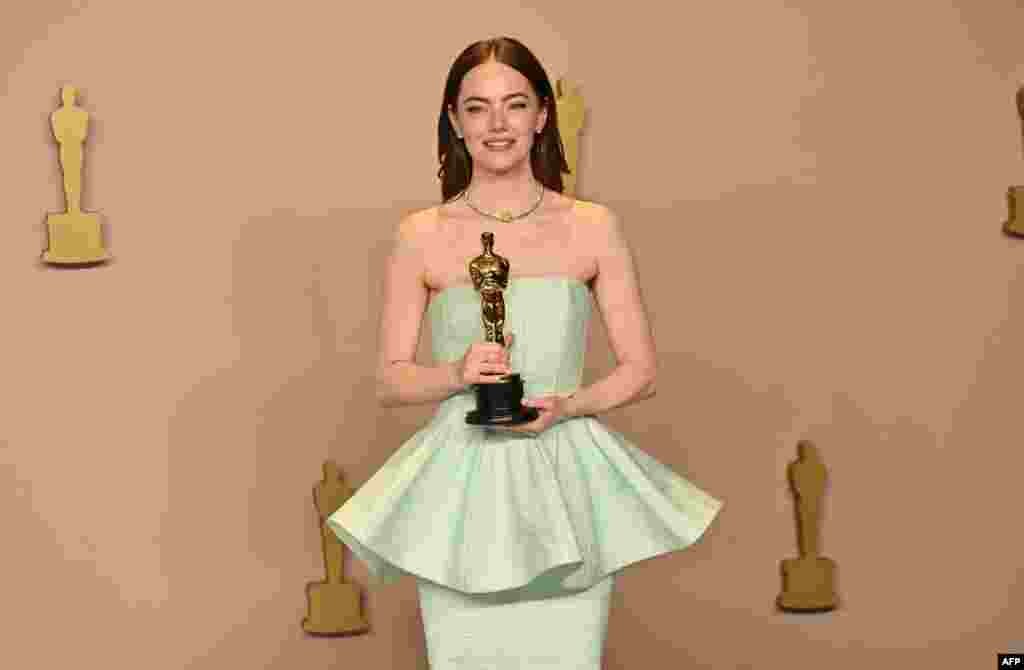 U.S. actress Emma Stone poses in the press room with the Oscar for Best Actress in a Leading Role for "Poor Things" during the 96th Annual Academy Awards at the Dolby Theatre in Hollywood, California, on March 10, 2024.