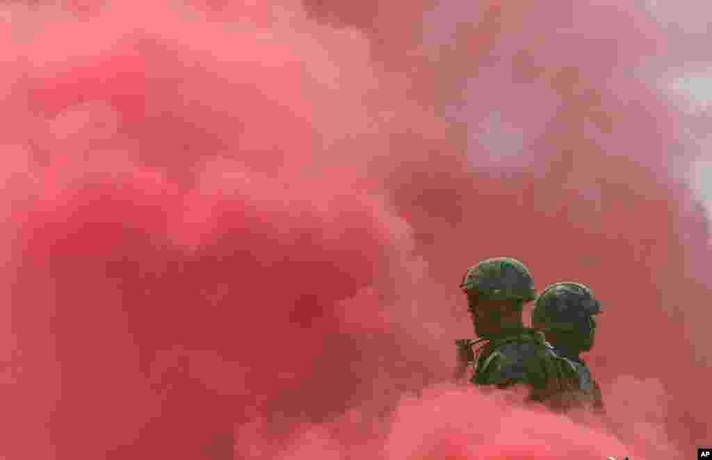 South Korean and U.S. Marines stand in smoke during the 66th Incheon Landing Operations Commemoration ceremony in Incheon, South Korea. Incheon is the coastal city where U.N. forces led by U.S. Gen. Douglas MacArthur landed in September, 1950 just months after North Korea invaded the South.