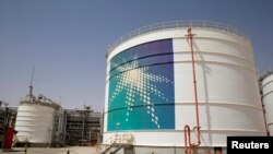FILE - An Aramco oil tank is seen at the production facility at Saudi Aramco's Shaybah oilfield in the Empty Quarter, Saudi Arabia, May 22, 2018.